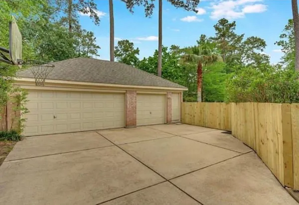 a view of backyard of house along with trees