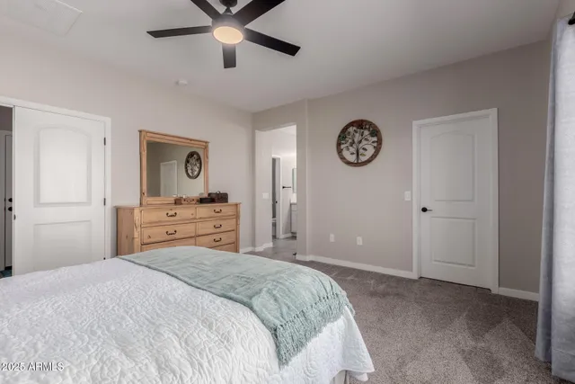 a bedroom with a bed and a table