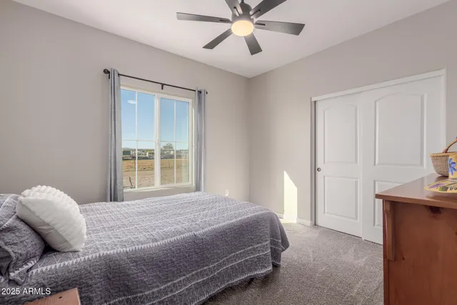 a bedroom with a bed and window