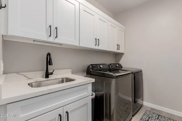 a kitchen with stainless steel appliances granite countertop a sink and cabinets