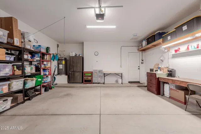 a kitchen with lots of wooden furniture and appliances