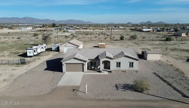 an aerial view of residential houses with outdoor space