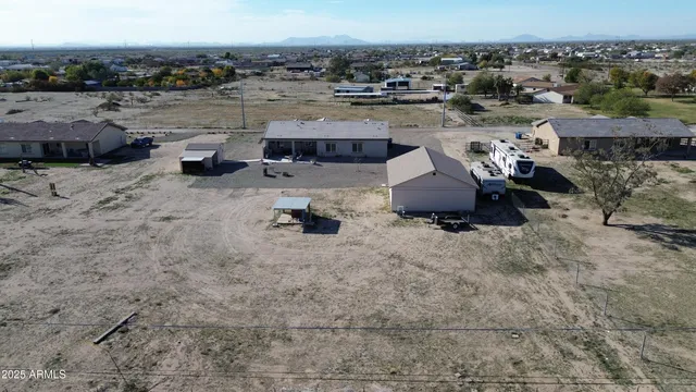 a view of a terrace with lawn chairs