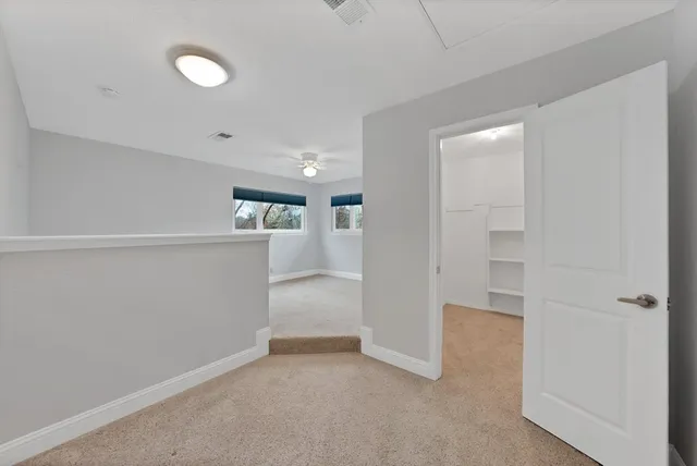 a view of a patio with table and chairs