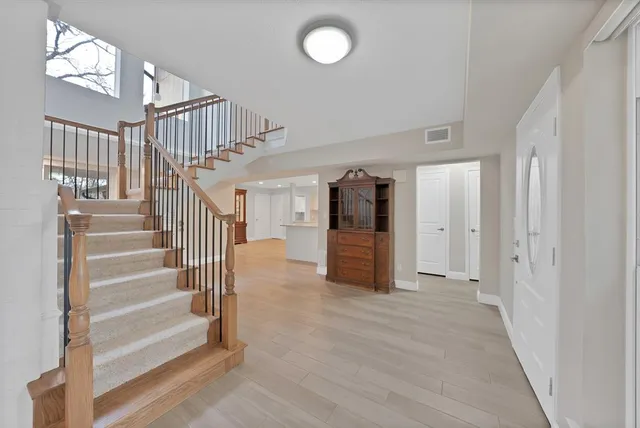 an aerial view of a house with a yard basket ball court and outdoor seating