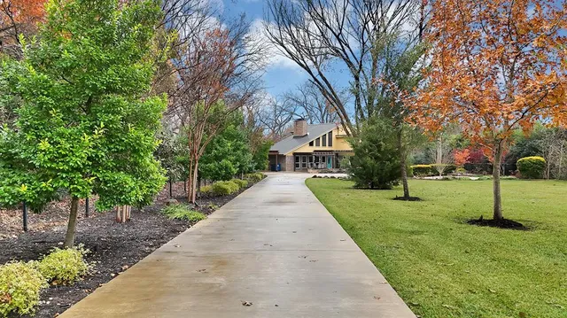 a living room with fireplace furniture and a flat screen tv