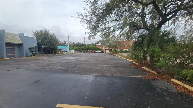 a view of a street with a building in the background