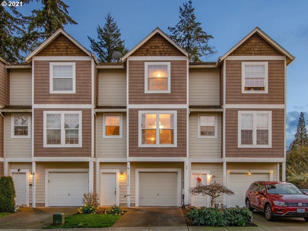 20078 Southwest Monson Street Beaverton, OR 97003 - Photo 1 of 32 a front view of a house with a yard and garage
