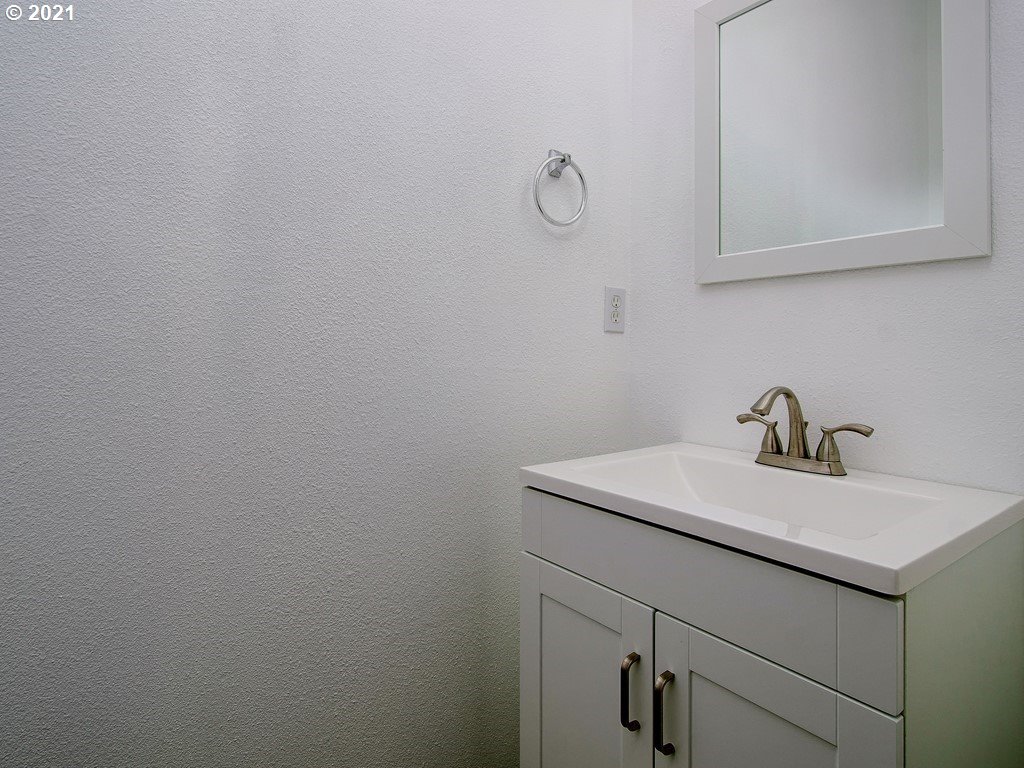 20078 Southwest Monson Street Beaverton, OR 97003 - Photo 13 of 32 a bathroom with a sink and vanity