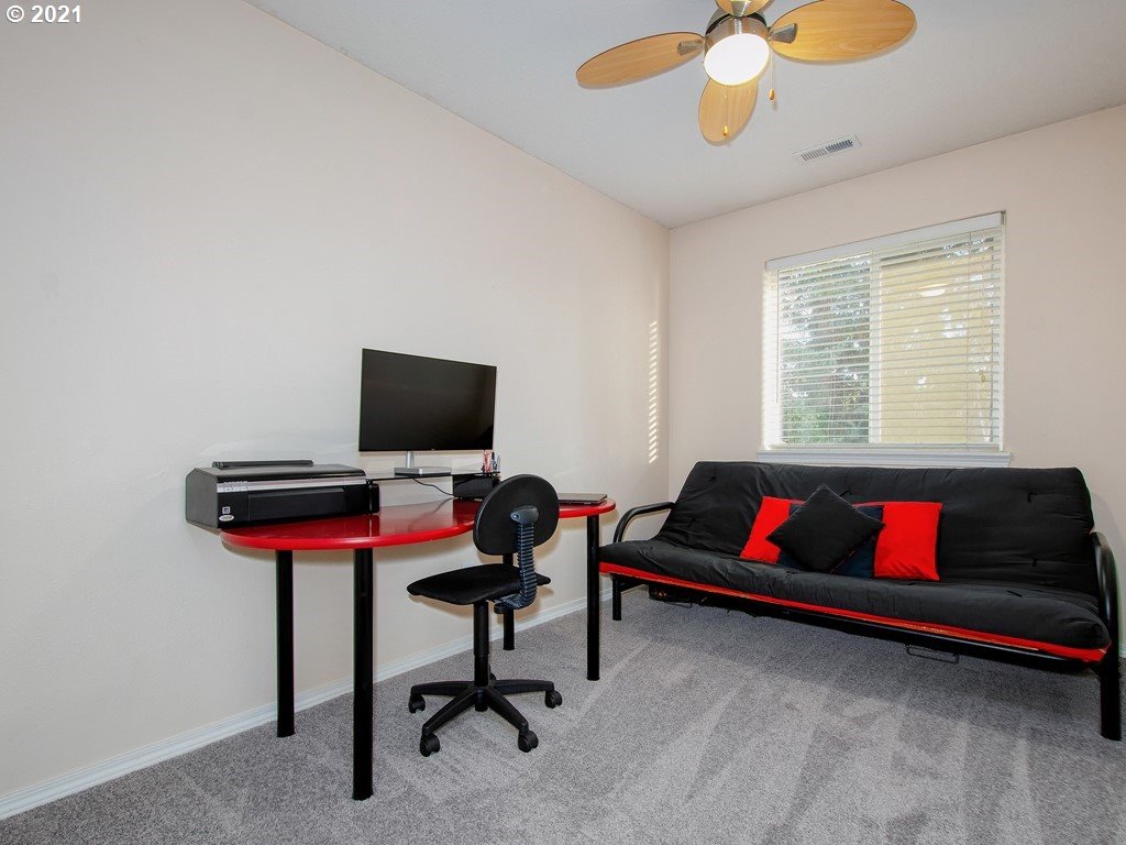 20078 Southwest Monson Street Beaverton, OR 97003 - Photo 20 of 32 a living room with furniture and a flat screen tv