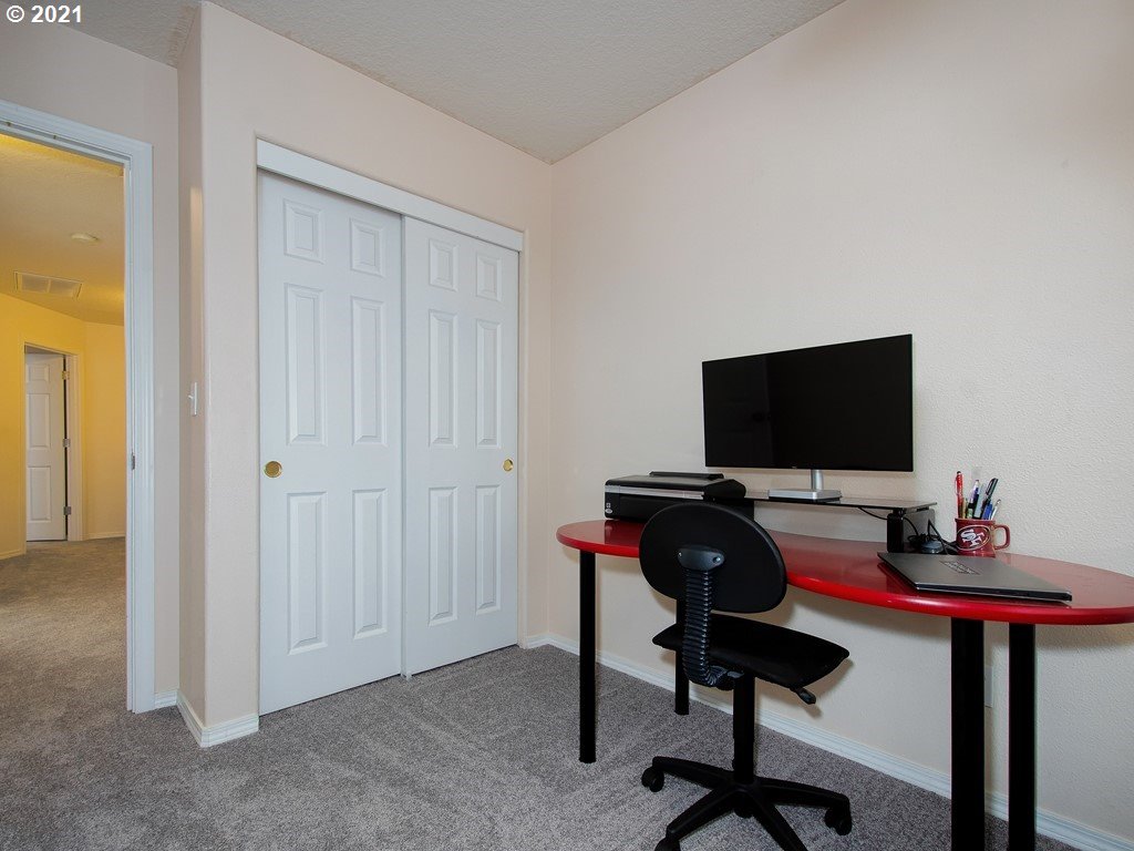 20078 Southwest Monson Street Beaverton, OR 97003 - Photo 21 of 32 a room with furniture and a flat screen tv