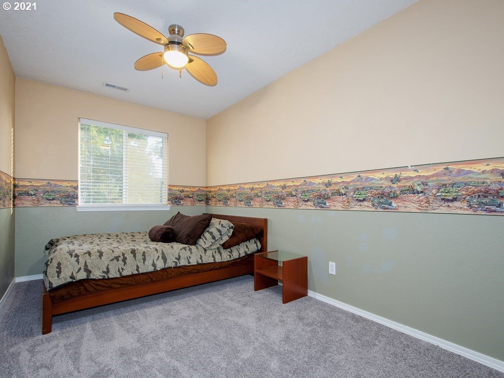 20078 Southwest Monson Street Beaverton, OR 97003 - Photo 22 of 32 a bedroom with furniture and window