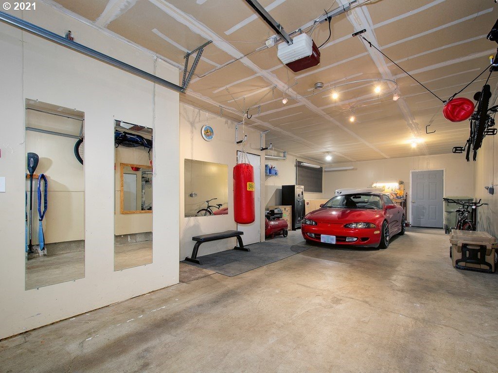20078 Southwest Monson Street Beaverton, OR 97003 - Photo 26 of 32 a view of a garage with cars
