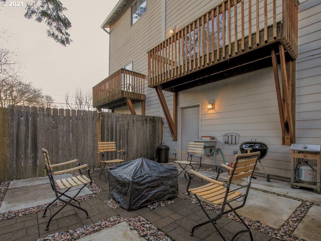 20078 Southwest Monson Street Beaverton, OR 97003 - Photo 30 of 32 a backyard of a house with table and chairs