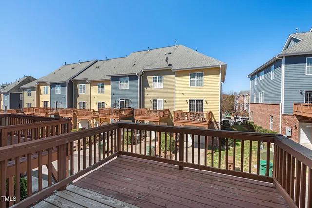 a kitchen with stainless steel appliances granite countertop a refrigerator a sink and a stove