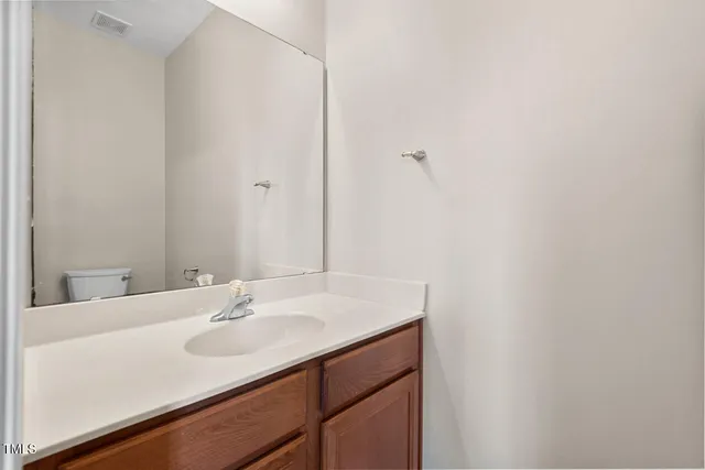 a view of a brick house with large windows