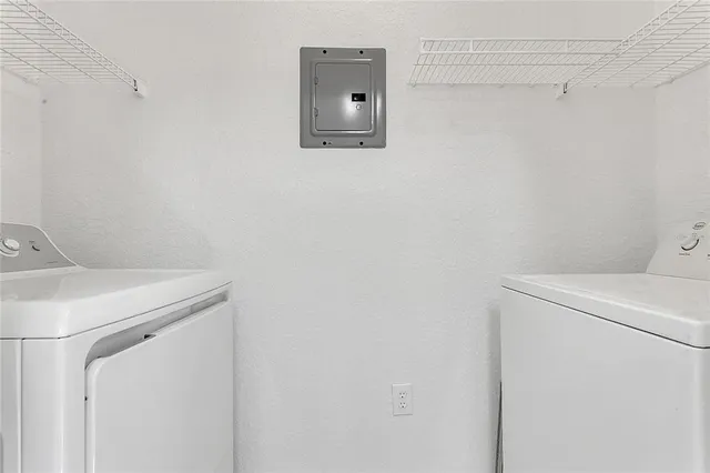 a utility room with dryer and washer
