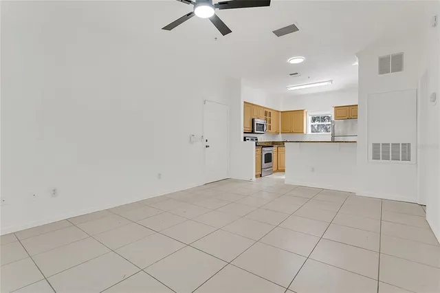 a view of a kitchen with a sink and cabinets