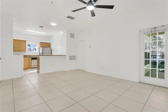 a view of a kitchen with a sink and a window