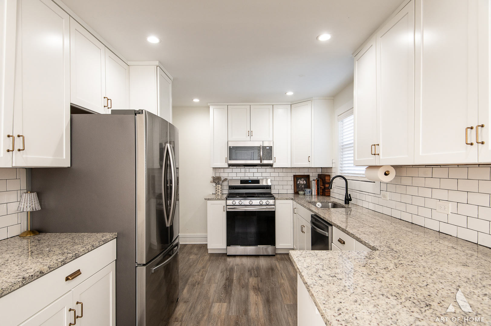 262 Lionel Road Riverside, IL 60546 - Photo 9 of 25 a kitchen with stainless steel appliances granite countertop a refrigerator sink and stove