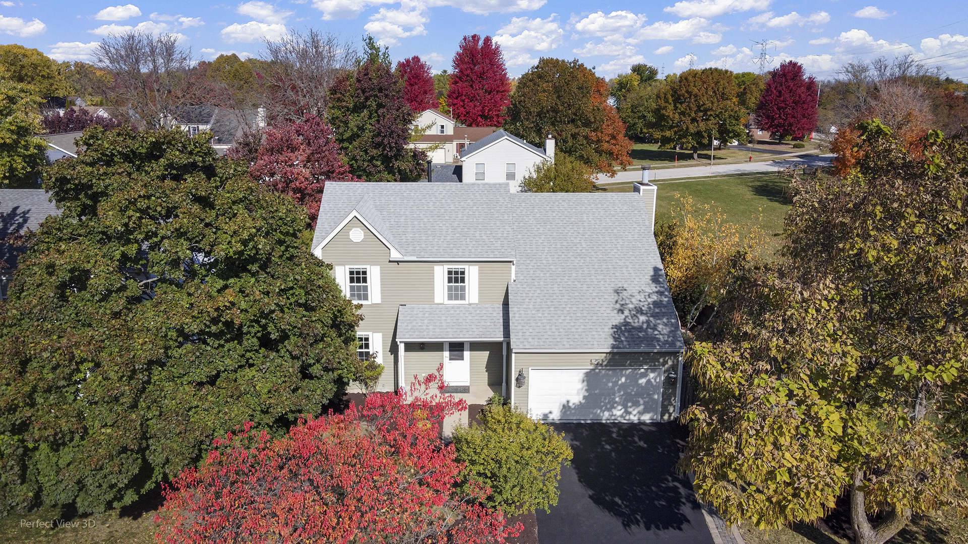 3290 Johnsbury Court Aurora, IL 60504 - Photo 2 of 31 aerial view of a house with a yard and a large tree in the background