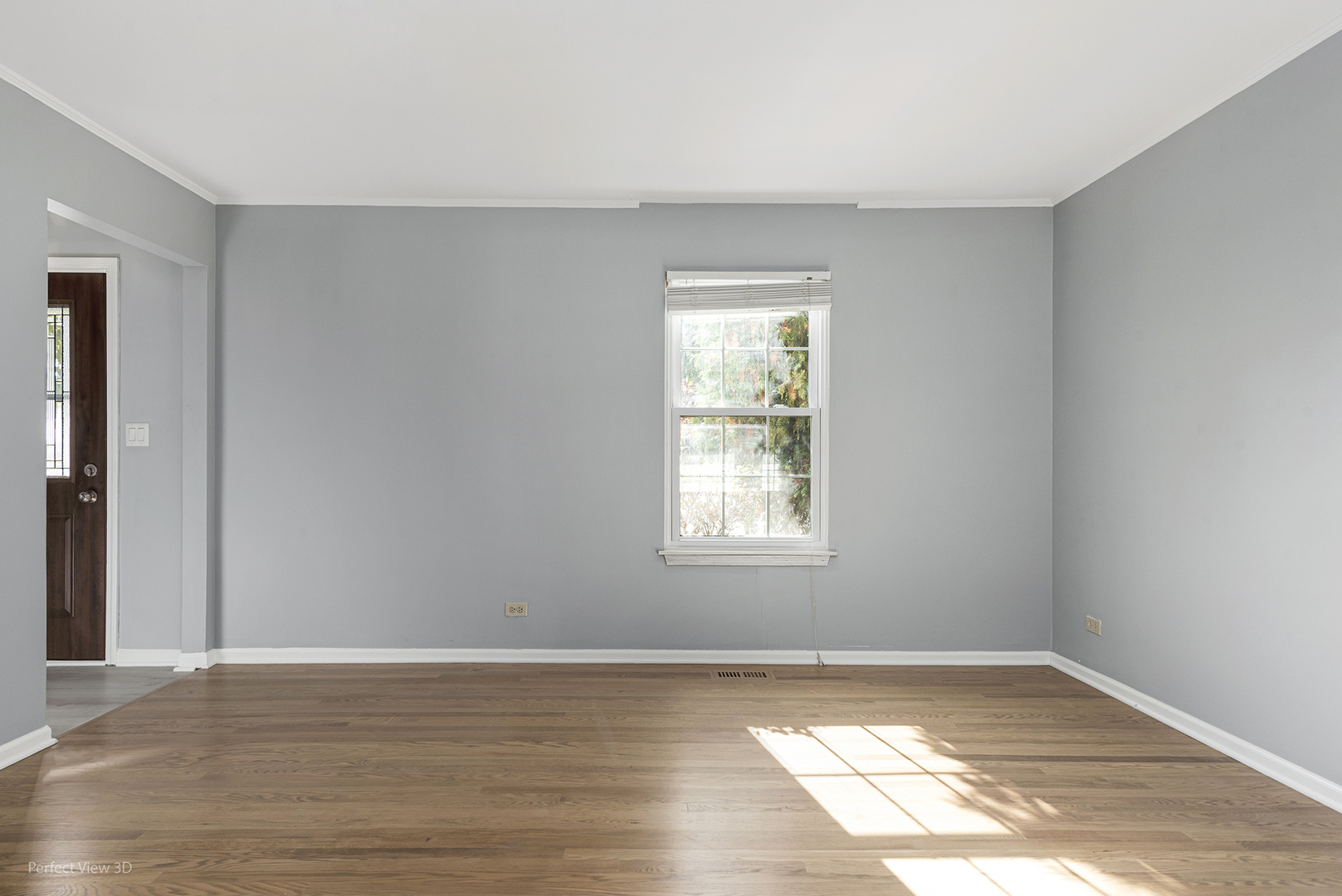 3290 Johnsbury Court Aurora, IL 60504 - Photo 5 of 31 a view of an empty room with wooden floor and a window