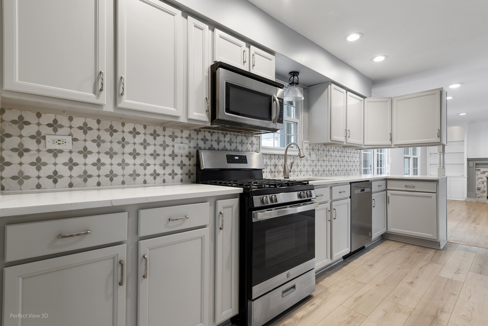 3290 Johnsbury Court Aurora, IL 60504 - Photo 7 of 31 a kitchen with stainless steel appliances granite countertop a sink dishwasher a stove and a microwave oven with cabinets