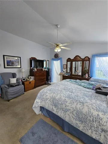 a bed room with bed and window