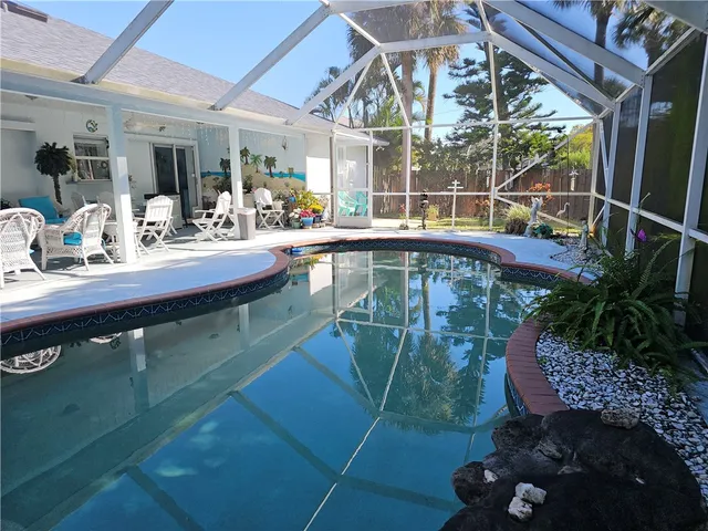 a view of a living room and kitchen