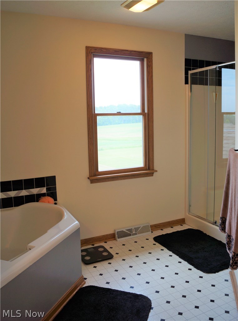 3206 Bandy Road Homeworth, OH 44634 - Photo 22 of 30 CORNER TUB IS JETTED AND WALK IN SHOWER!