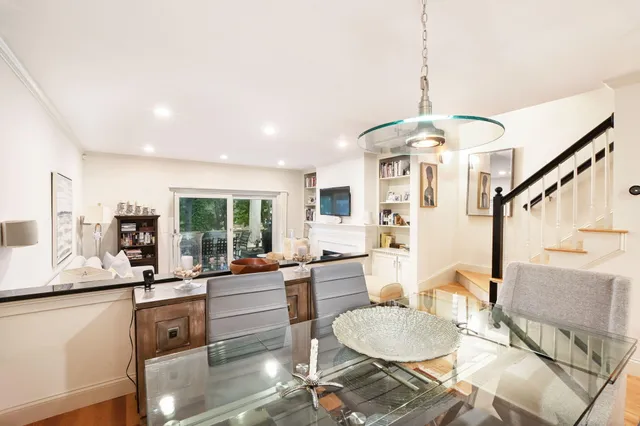 a kitchen with granite countertop a stove a sink and a microwave
