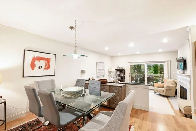 a kitchen with stainless steel appliances granite countertop a stove a refrigerator and a sink