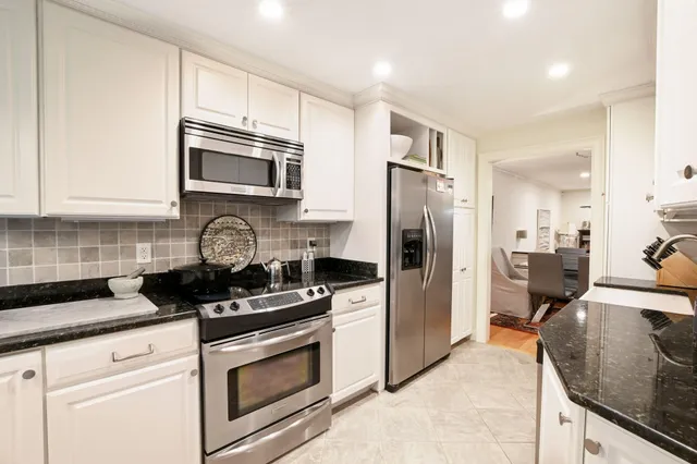 a spacious bedroom with two beds and a large window