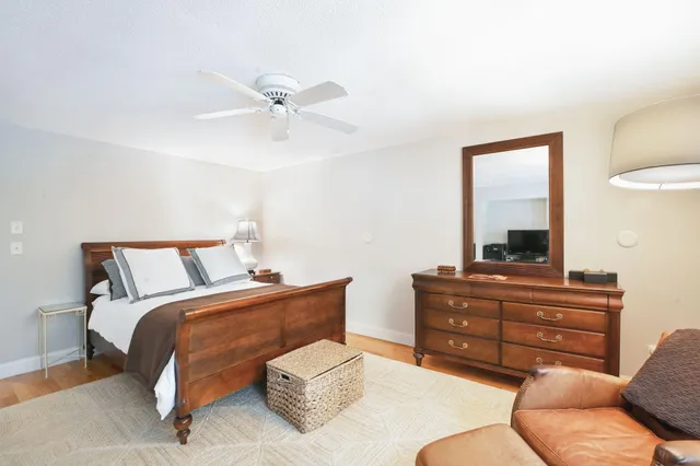 a bathroom with a sink a toilet and shower curtain