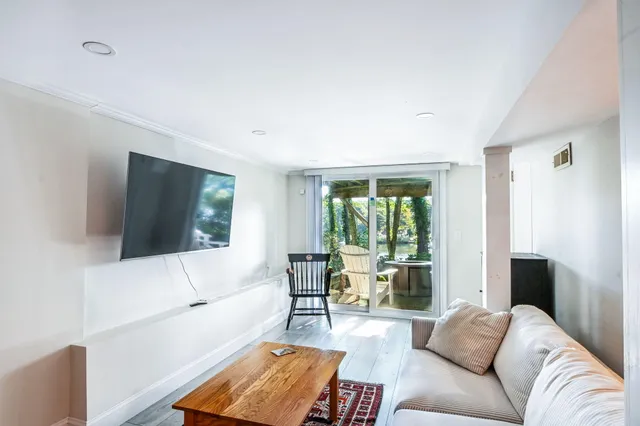 a view of a backyard with sitting area