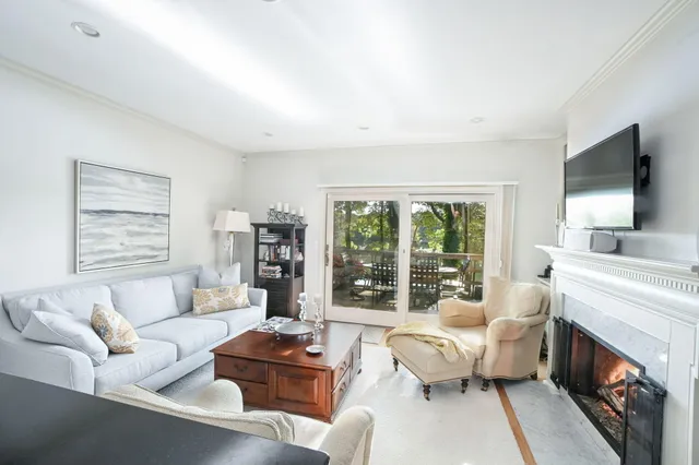 a living room with furniture and a table