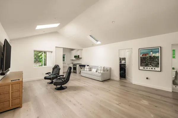 a view of a livingroom with workspace and a window