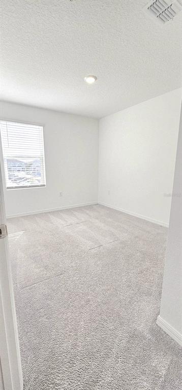 5000 Revolutionary Way St. Cloud, FL 34769 - Photo 29 of 32 an empty room with a window