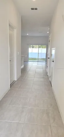 a view of hallway with a large window