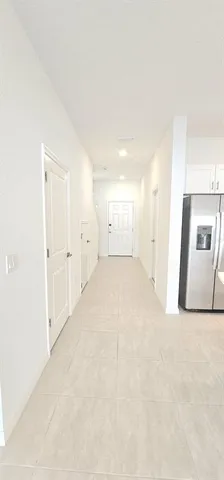 a view of a livingroom with a kitchen