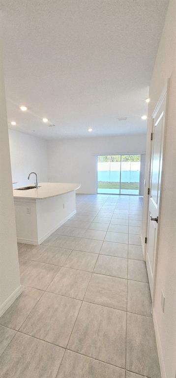 5000 Revolutionary Way St. Cloud, FL 34769 - Photo 7 of 32 a view of an empty room with a window