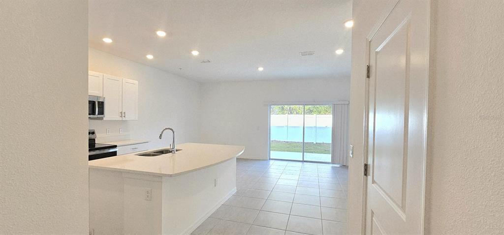 5000 Revolutionary Way St. Cloud, FL 34769 - Photo 9 of 32 a bathroom with a sink a toilet and a mirror