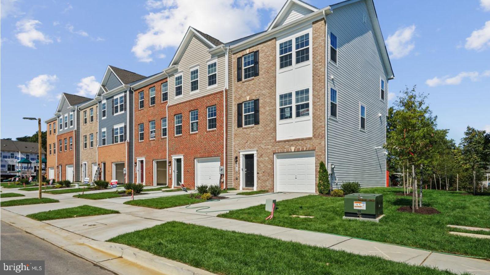 8709 Tavern Street Clinton, MD 20735 - Photo 1 of 25 a view of a building with a yard