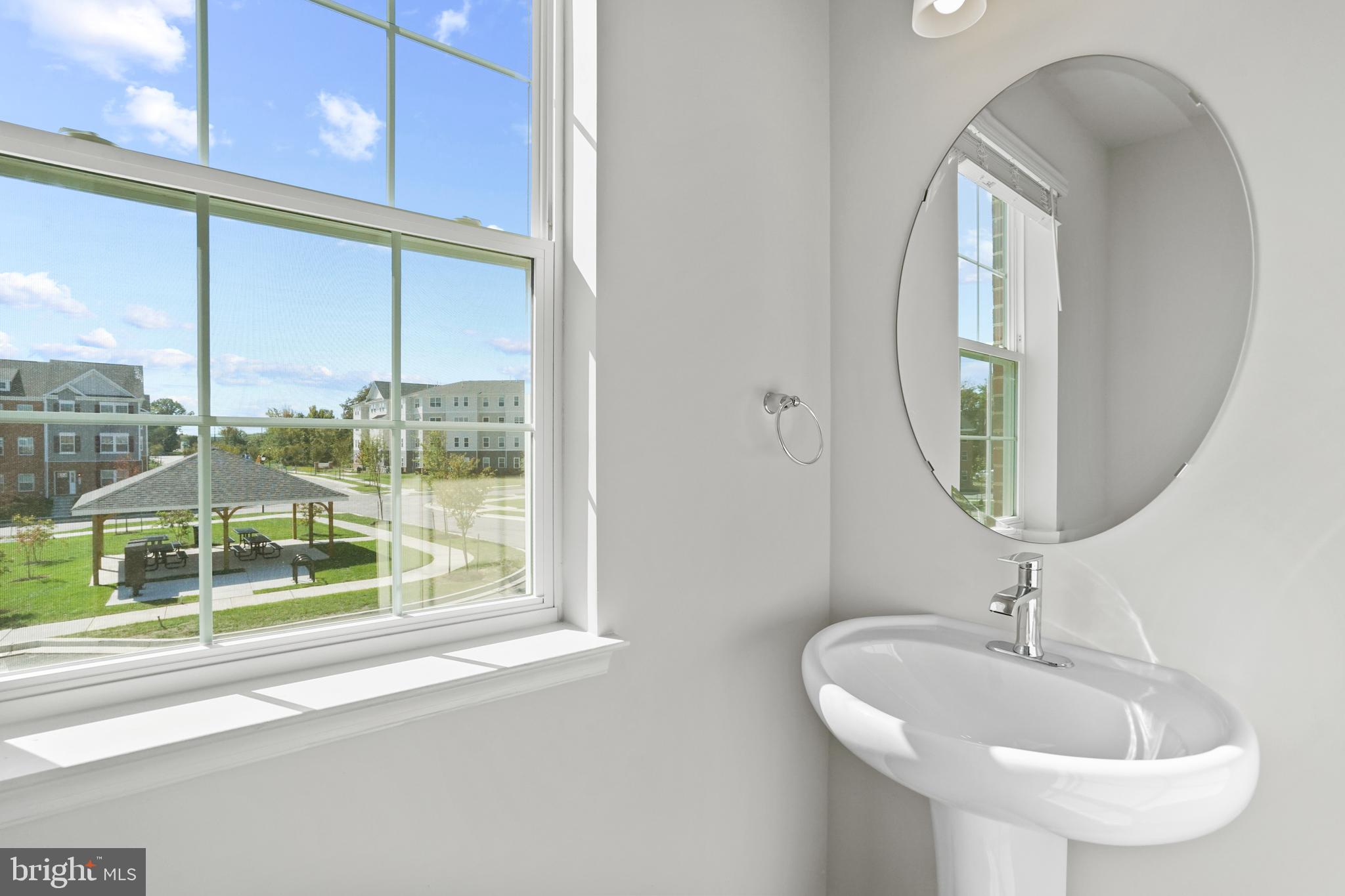 8709 Tavern Street Clinton, MD 20735 - Photo 12 of 25 a bathroom with a sink and a mirror