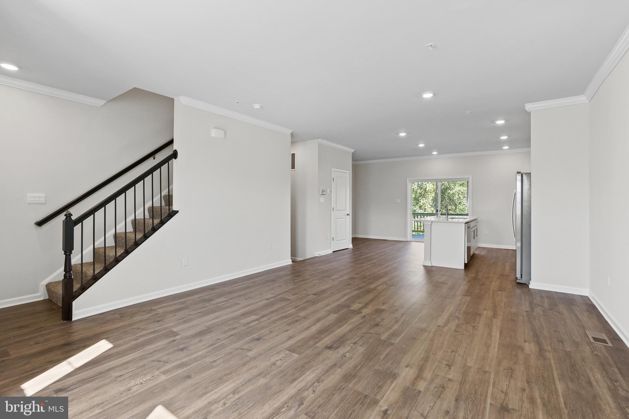8709 Tavern Street Clinton, MD 20735 - Photo 14 of 25 a view of an empty room with wooden floor