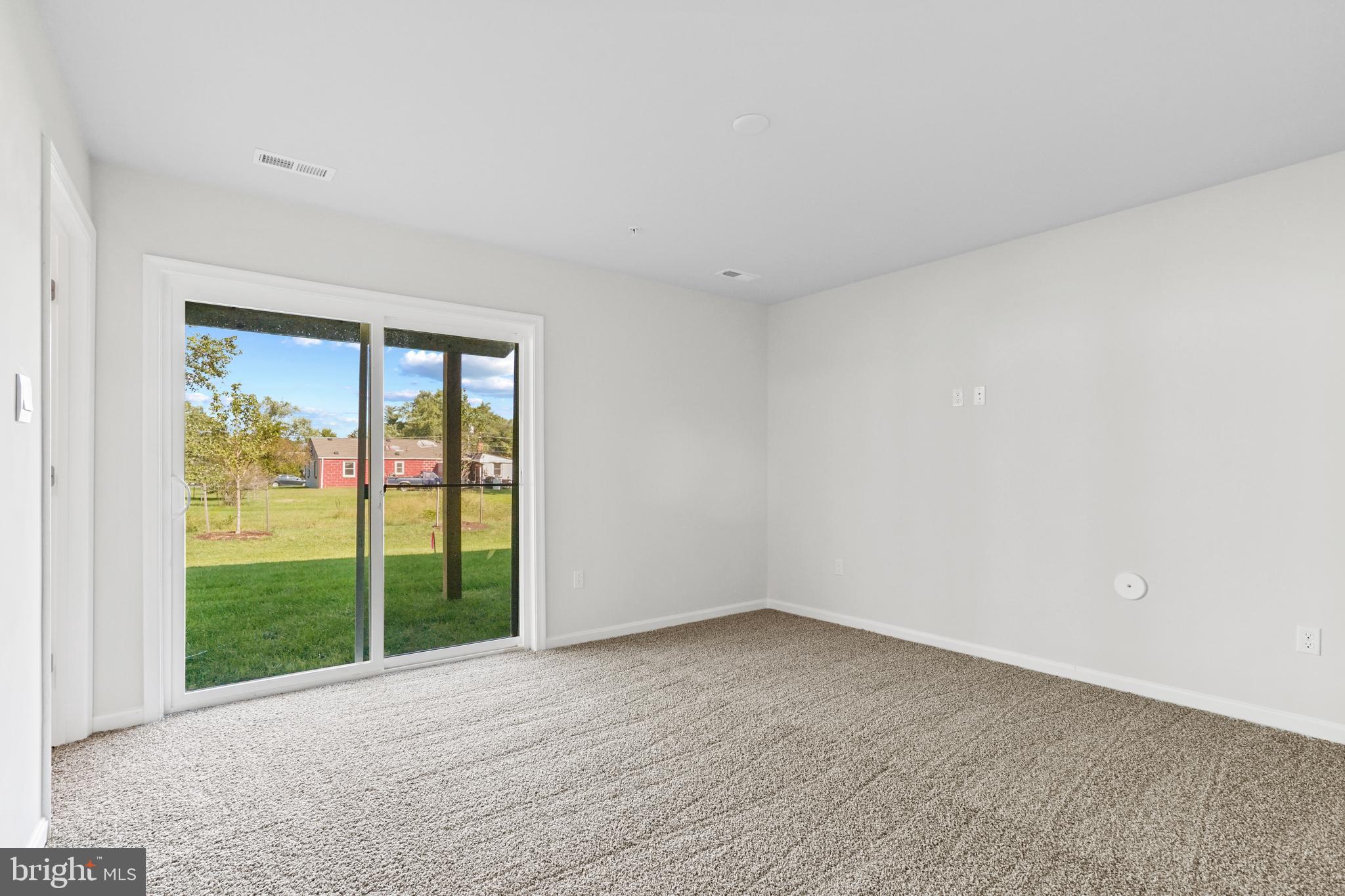 8709 Tavern Street Clinton, MD 20735 - Photo 22 of 25 a view of an empty room with a window