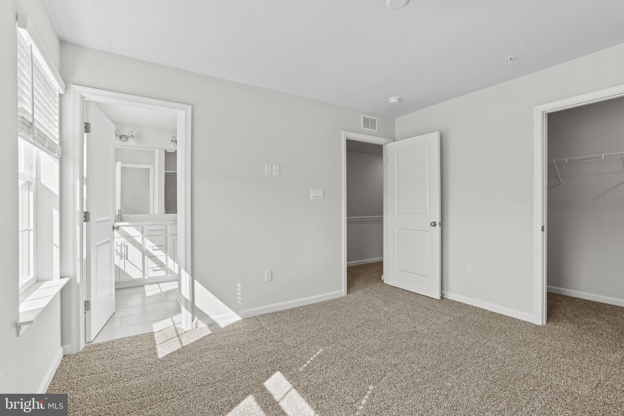 8709 Tavern Street Clinton, MD 20735 - Photo 10 of 25 a view of an empty room with wooden floor and a livingroom