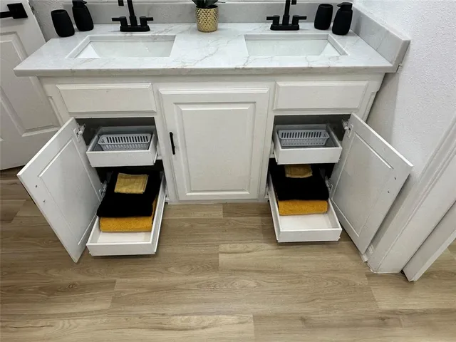 an empty room with a ceiling fan and carpet