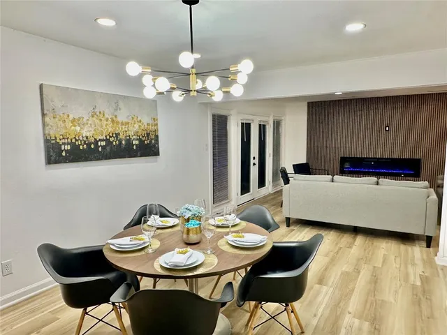 a view of an empty room with a ceiling fan