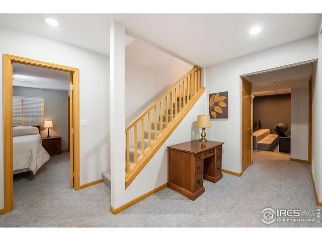 a view of a livingroom with furniture and stairs